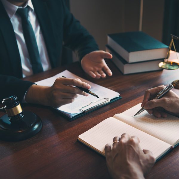 Man judge is currently advising clients on their requests for legal proceedings and legal advice.